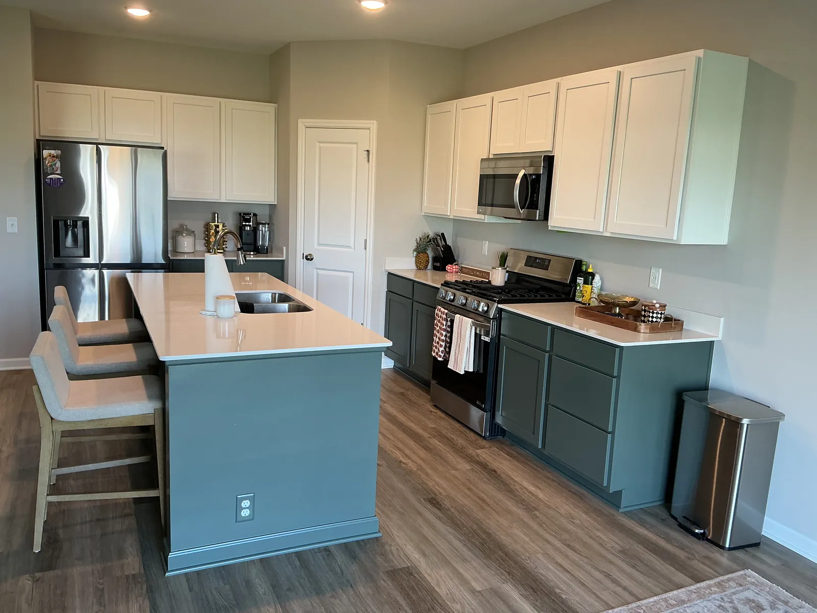St. Michael kitchen with Pewter Green base cabinets and island refinished, and the existing white uppers.